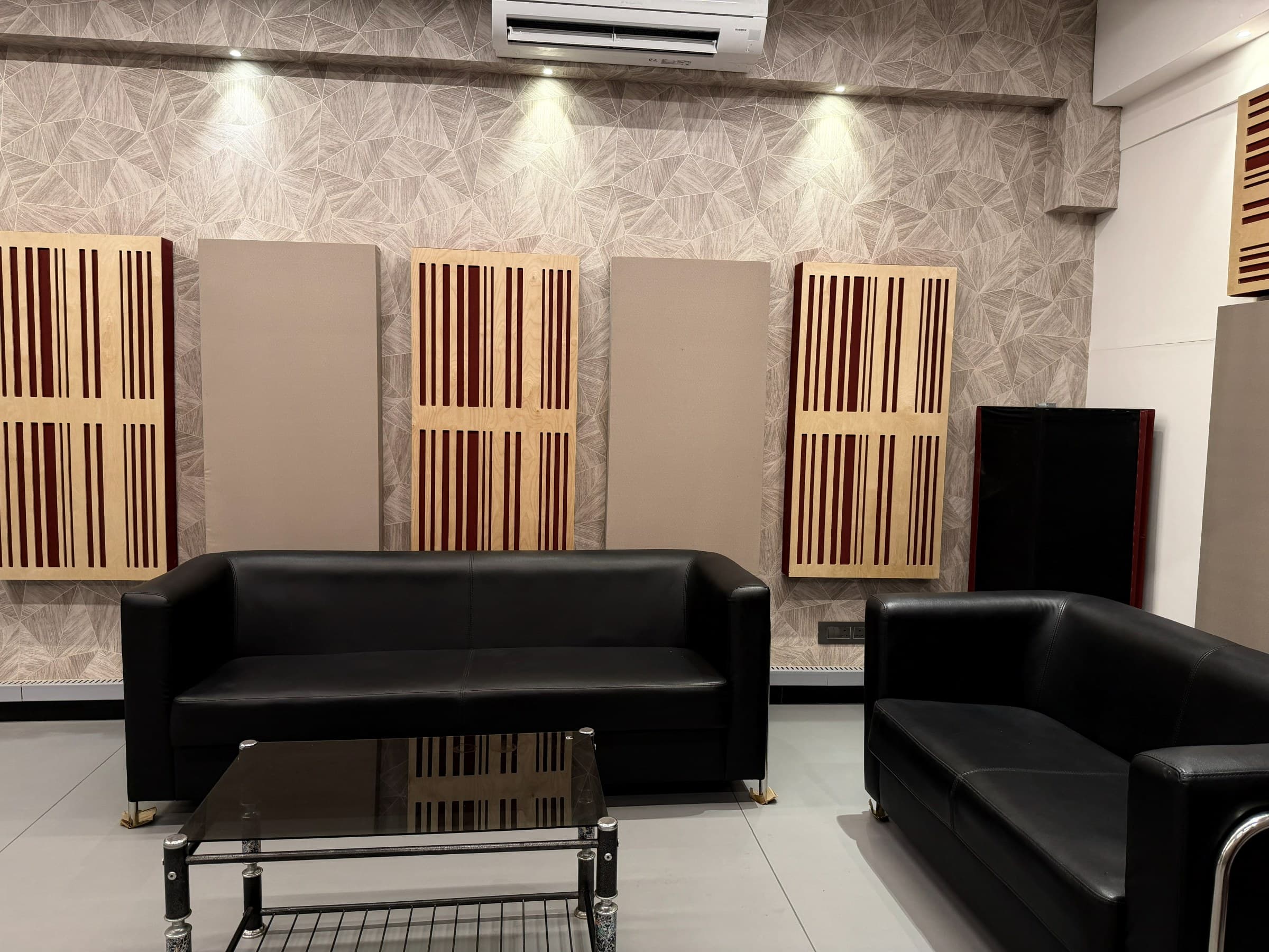 Artist lounge with leather sofas and acoustic panels